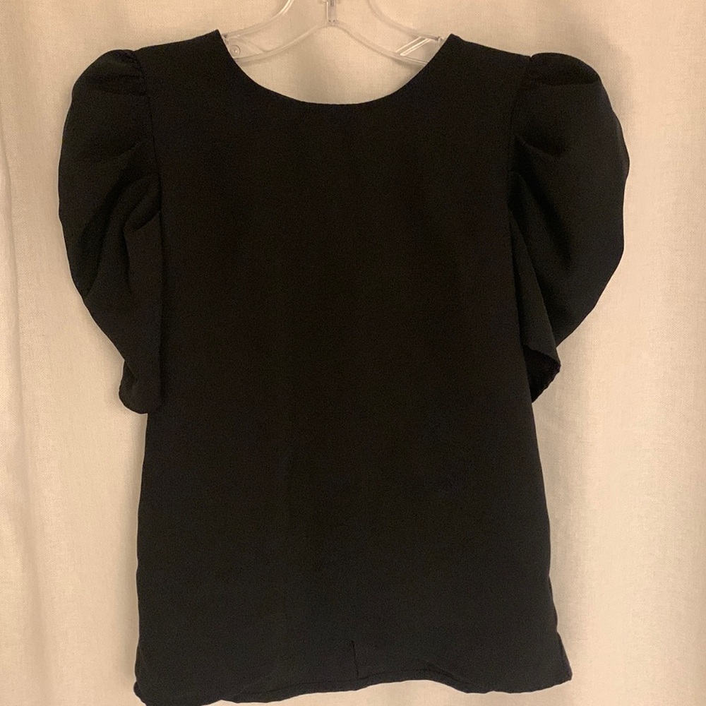 Black polyester top size small with puffy shoulders.